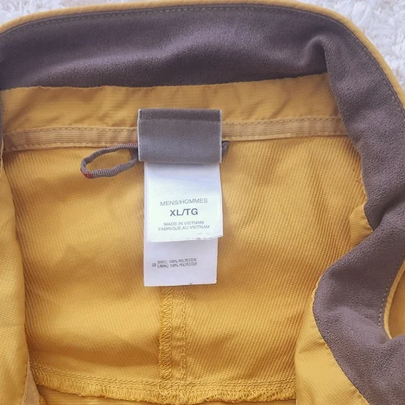 The North Face Flight SerieYellow and Gray Windbreaker.